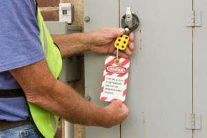 Man Addressing LOTO at machine