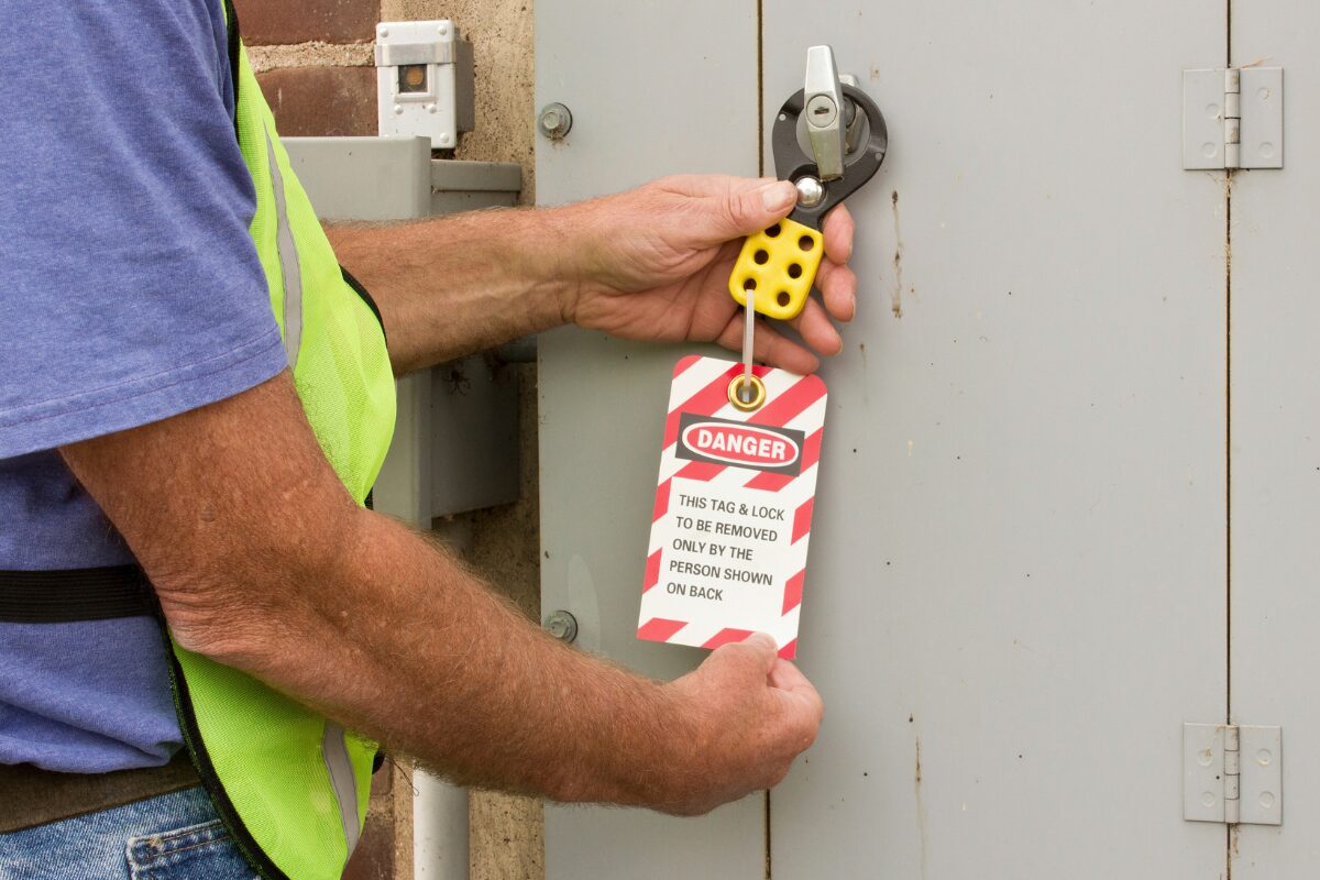 Man Addressing LOTO at machine